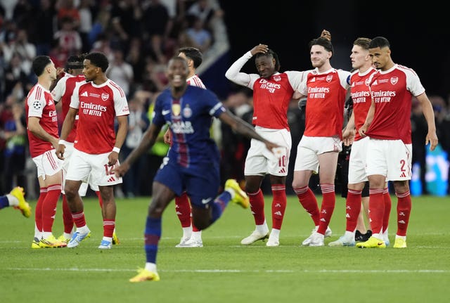Arsenal players appear dejected after losing the penalty shoot-out