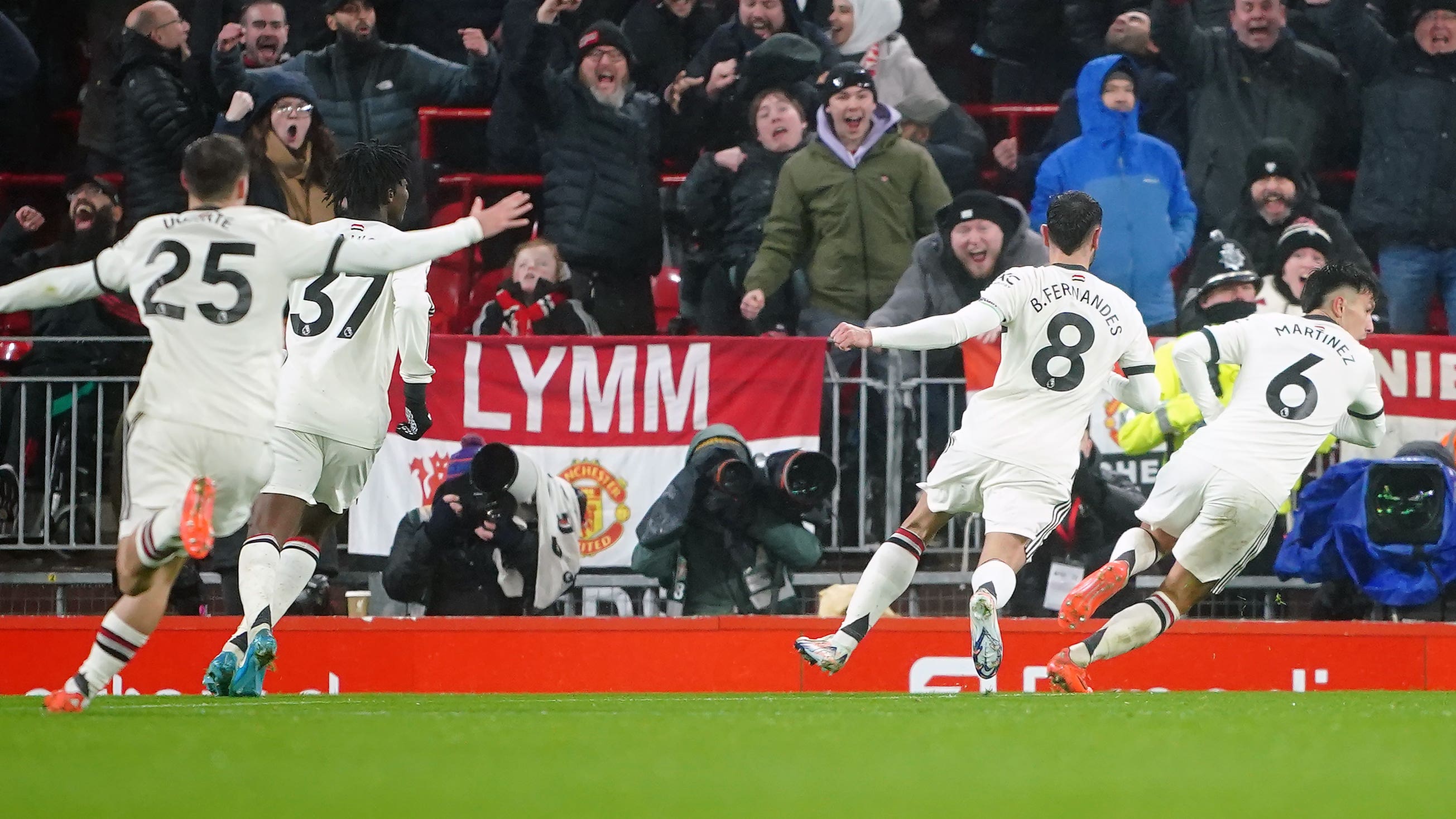Lisandro Martinez, right, celebrates after scoring Manchester United’s first goal of the game during the Premier League match at Anfield, Liverpool. Picture date: Sunday January 5, 2025.