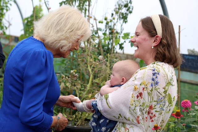 Camilla meets three–month–old Rose Stubbings and her mother Harriet in the allotment 