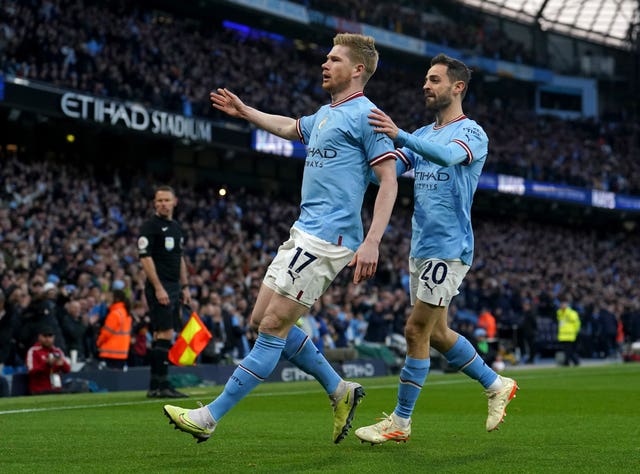 Kevin De Bruyne (left) and Bernardo Silva celebrate after scoring against Arsenal