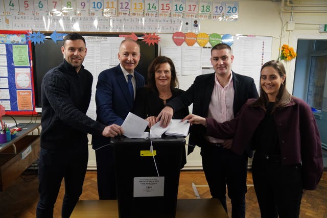 Tanaiste and Fianna Fail leader Micheal Martin, accompanied by his family, casts his vote at St Anthony’s Boys’ School in Cork