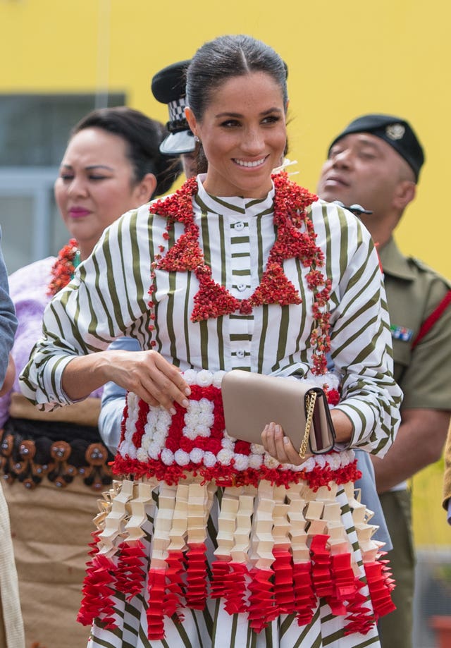 Meghan looked in good form, beaming as she soaked up the atmosphere