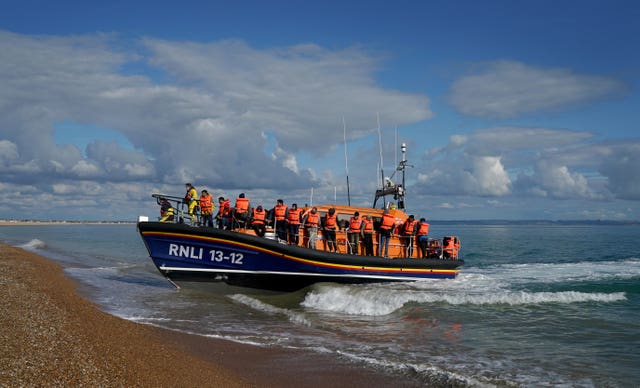 A group of people thought to be migrants are brought in to Dungeness, Kent (Gareth Fuller/PA)