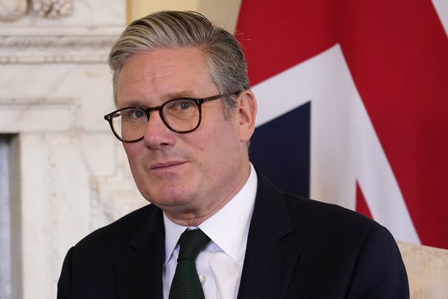 Sir Keir Starmer stands in front of a Union Jack in 10 Downing Street