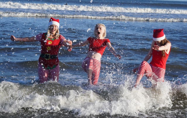 Bathers take part on the 2022 annual Boxing Day Swim at Tynemouth Longsands