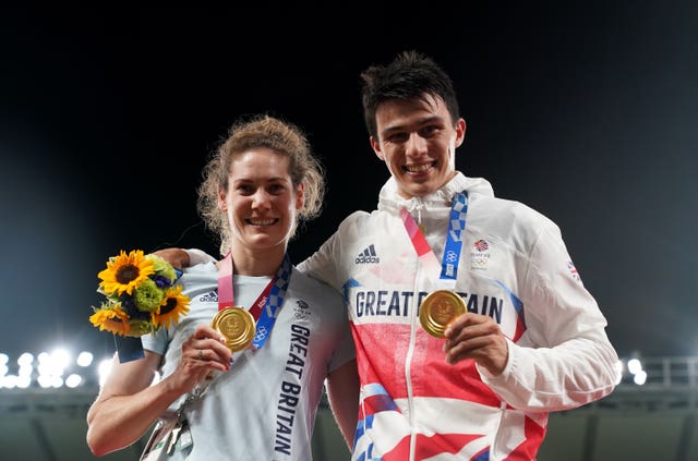 Joe Choong (right) and Kate French with their hold medals