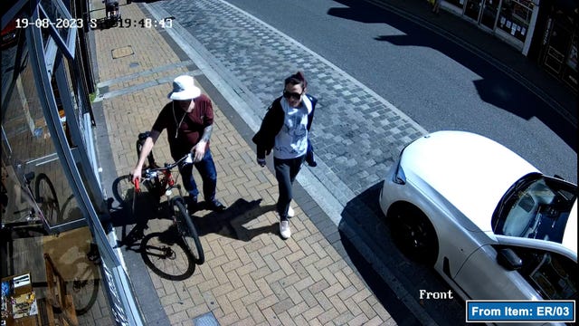 CCTV showing Benjamin Atkins and Debbie Pereira walking with a hacksaw