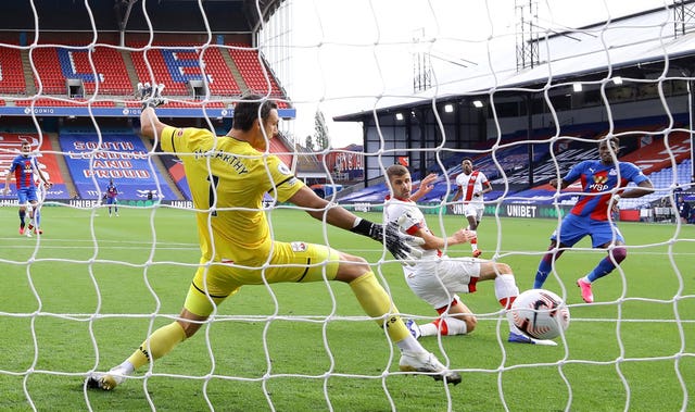 Wilfried Zaha, right, beats Southampton goalkeeper Alex McCarthy, left, to score the only goal of the game at Selhurst Park 