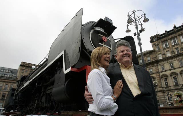 Hollywood star Robbie Coltrane with Carol Smillie as they attend the return of a historic Scottish steam engine to the city of Glasgow after 60 years in South Africa, the ceremony held in George Square is Glasgow Museums’ largest ever acquisition August 24 2007