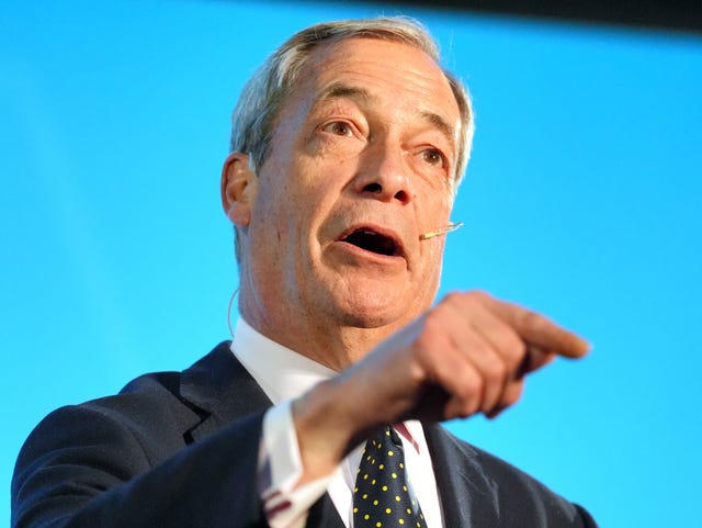 Headshot of Nigel Farage speaking, while pointing with one hand