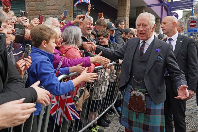 King Charles III greets members of the public as he arrives at an official council meeting at the City Chambers in Dunfermline, Fife, to formally mark the conferral of city status on the former town, ahead of a visit to Dunfermline Abbey to mark its 950th anniversary 