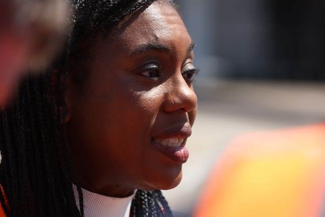 Conservative Party leader Kemi Badenoch meeting staff during a visit to Stansted Airport in Essex