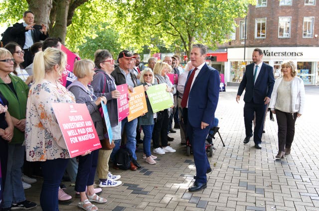 Labour leader Sir Keir Starmer talking to locals whilst on the Wakefield by-election campaign trail with Labour candidate Simon Lightwood (Peter Byrne/PA)