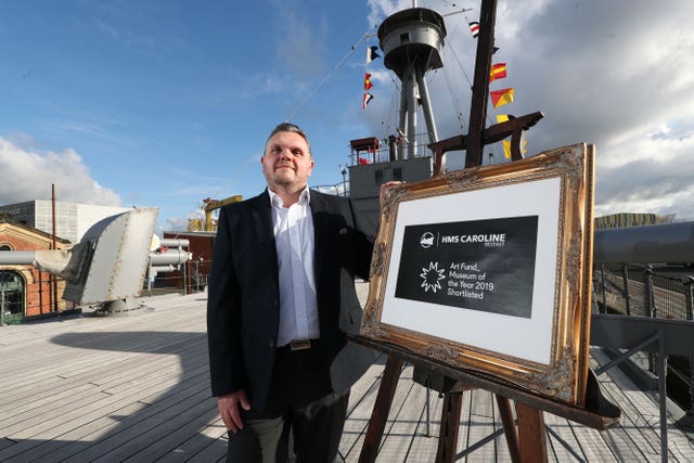 Captain John Rees on HMS Caroline docked in Belfast 