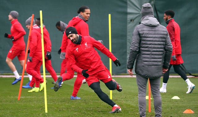 Mohamed Salah training ahead of the Champions League clash with Paris St Germain (Martin Rickett/PA).