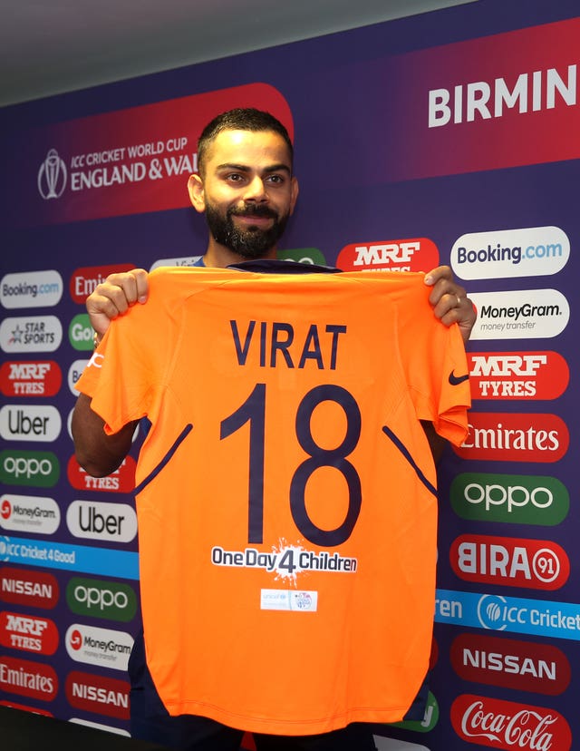 Virat Kohli shows off the new India shirt