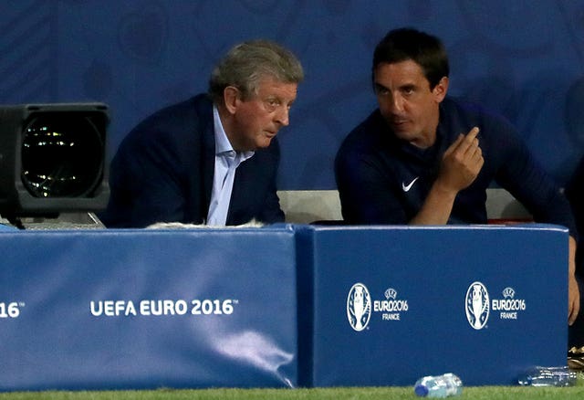 Gary Neville (right) also left his role as a coach following Hodgson's departure.