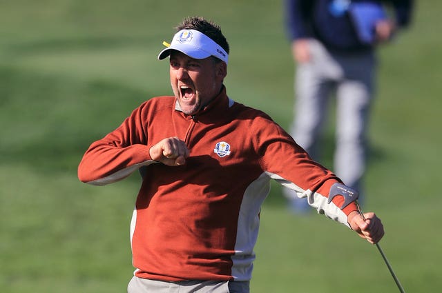 Ian Poulter celebrates his putt on the seven green