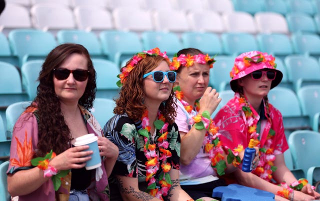 Four women watch a match in The Hundred