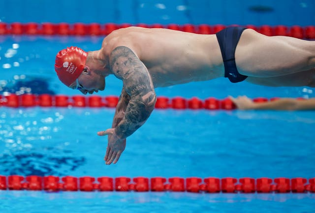 Britain's biggest gold medal hope, Adam Peaty, dives into the pool during a training session