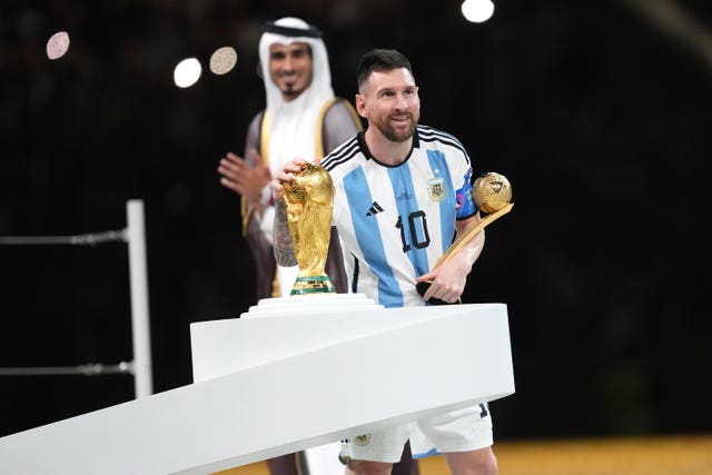 Argentina’s Lionel Messi kisses the World Cup trophy
