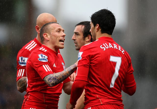 Craug Bellamy and Luis Suarez speak during a Liverpool game