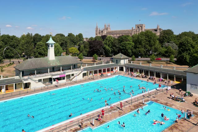 People swimming at Peterborough Lido in Peterborough, Cambridgeshire