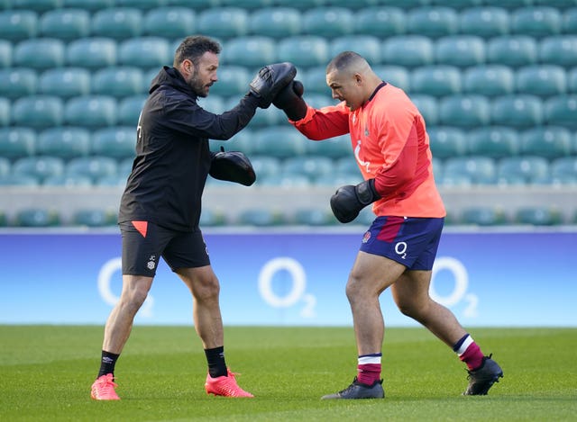 Ellis Genge (left) trains with England's head of strength and conditioning Jon Clarke (right). Short bursts of boxing are used to improve players' fitness (Andrew Matthews/PA)