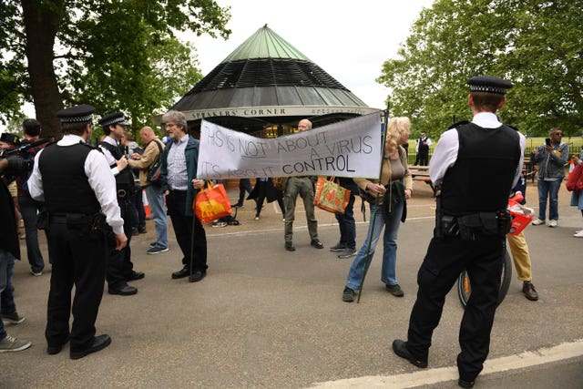 Police talk to protesters in Hyde Park 