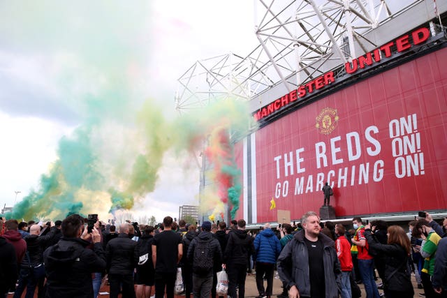 Fans let off flares as they protest outside Old Trafford