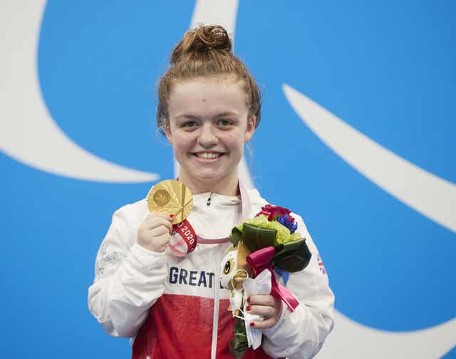 Great Britain’s Maisie Summers-Newton celebrates with her gold medal at the Paralympic Games