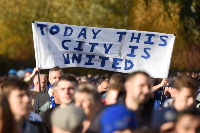Fans on a tribute walk to the King Power Stadium ahead of the match (Joe Giddens/PA).