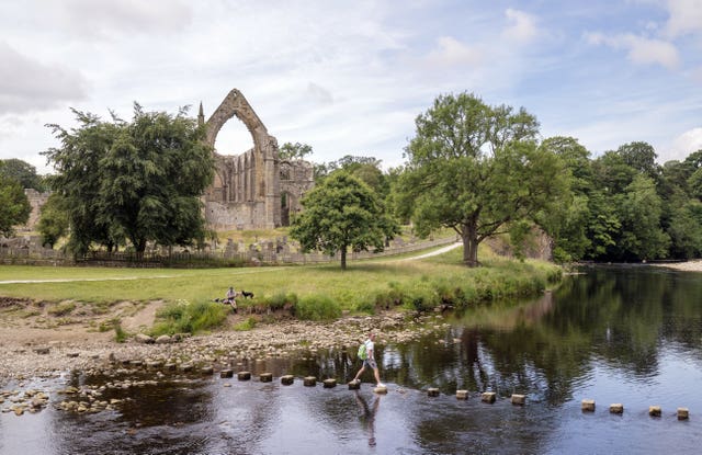 People enjoy the weather at Bolton Abbey in North Yorkshire