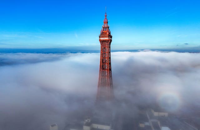 An aerial view of Blackpool Tower surrounded by fog