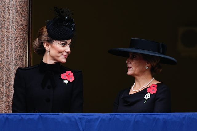 Kate and Sophie chat on the balcony