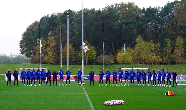 England players and staff observe a silence for Remembrance Day ahead of a training session at St George’s Park, Burton-upon-Trent