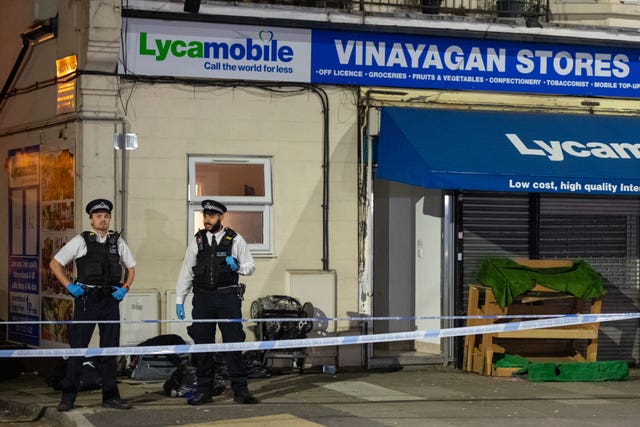 Police at the scene in Aldborough Road North, Ilford