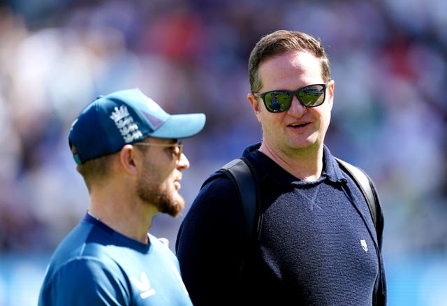 England managing director Rob Key, right, speaks to head coach Brendon McCullum