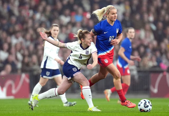 England’s Keira Walsh (left) and USA’s Lindsey Horan battle for the ball