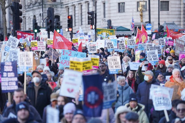 Protesters march towards Downing Street during the nurses' strike