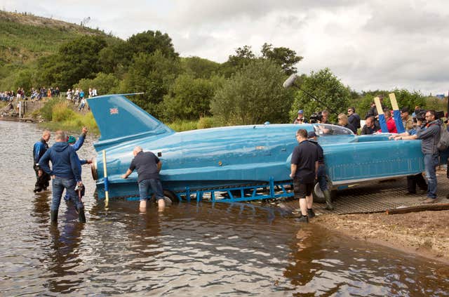 The Bluebird is lowered into the water