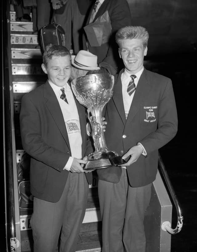 Terry Spinks, left, and Dick McTaggart holding the Val Barker trophy, awarded to McTaggart as the most stylish boxer at the 1956 Olympics