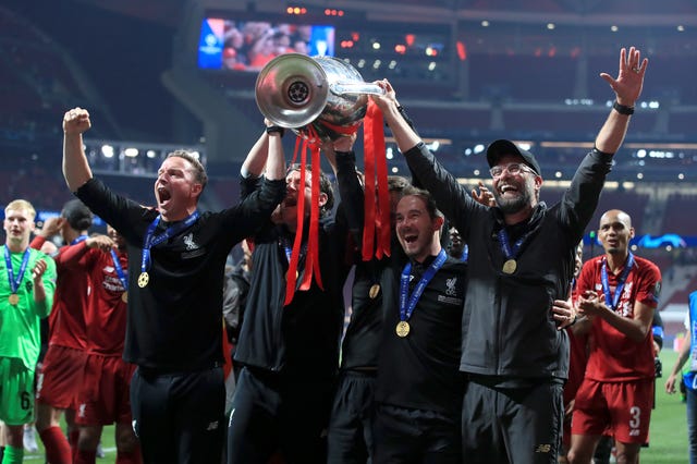 Jurgen Klopp Klopp (right) celebrates with the Champions League trophy
