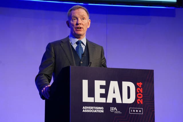 Sir Chris Bryant giving a speech at a lectern