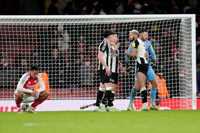 Newcastle players celebrate their win over Arsenal 