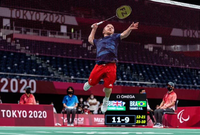 Great Britain’s Krysten Coombs jumps for a smash in his badminton bronze medal match