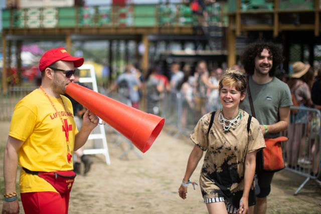 Lifeguards at the Glastonbury by the Sea attraction on the third day of the Glastonbury Festival at Worthy Farm in Somerset