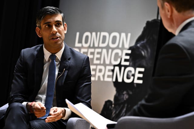 Rishi Sunak speaks with director of the London Defence Conference Ian Martin