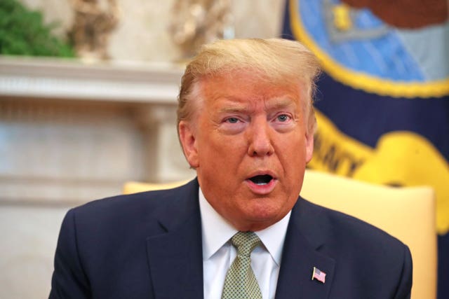 Donald Trump in the Oval Office during his presidency (Niall Carson/PA)