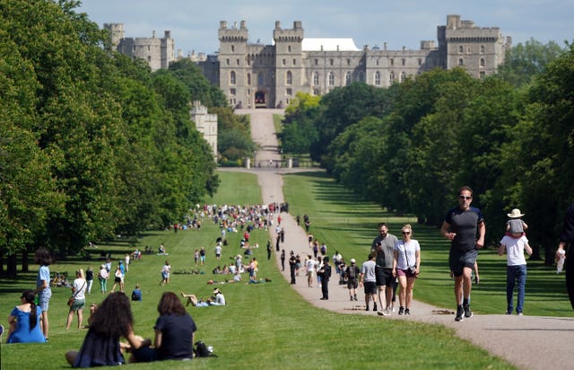 People make their way along the Long Walk in Windsor